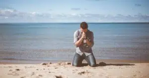 Man kneeling in prayer