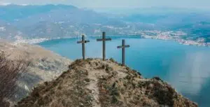 Three Crosses on a hill overlooking water