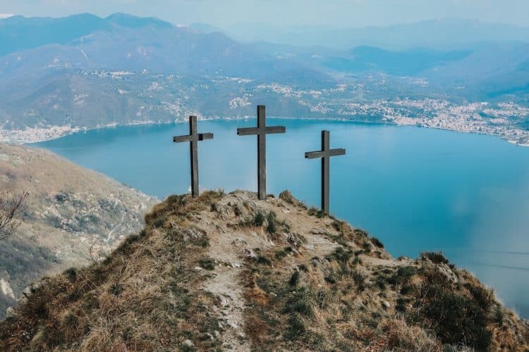 Three Crosses on a hill overlooking water
