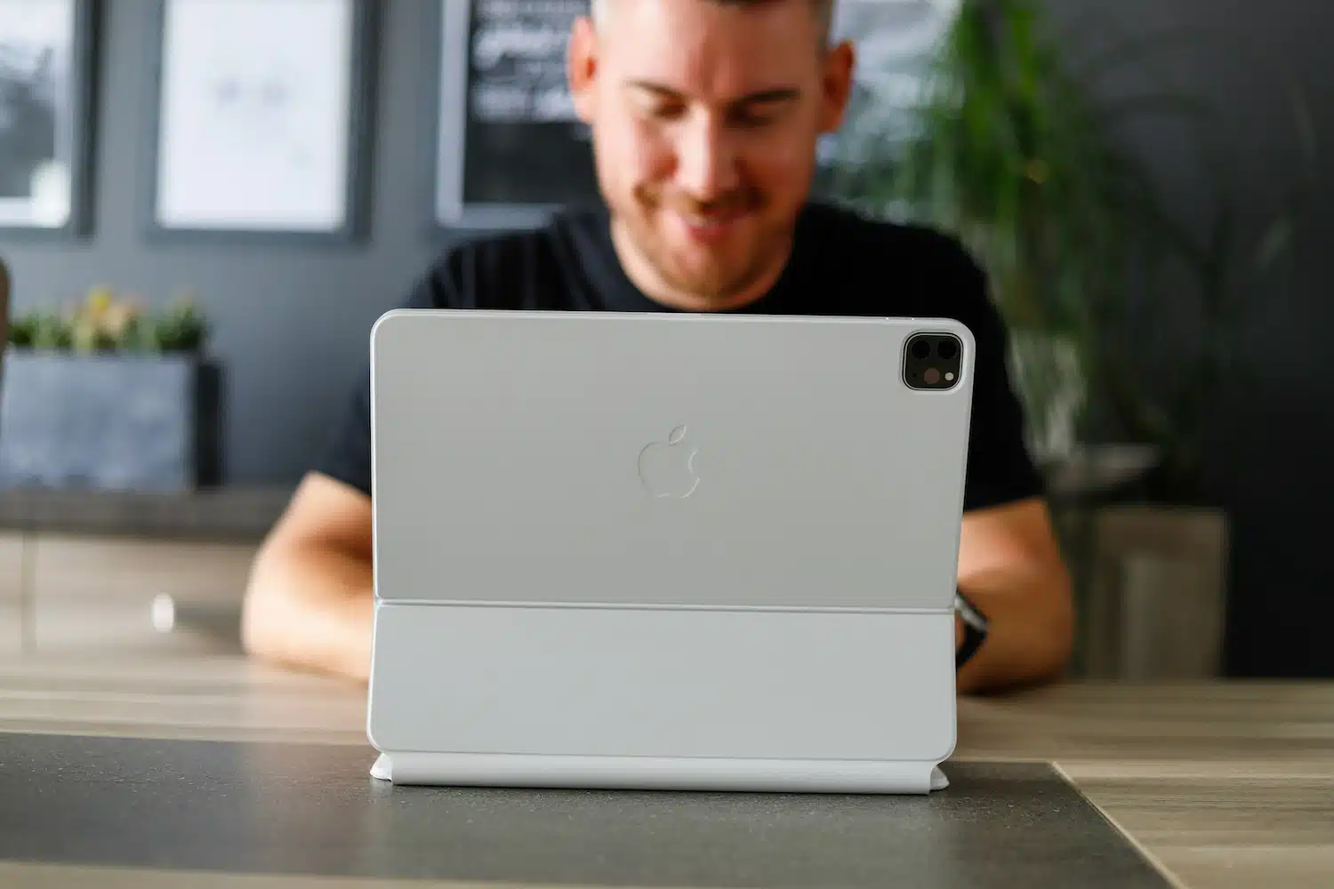 online courses photo - man smiling with tablet
